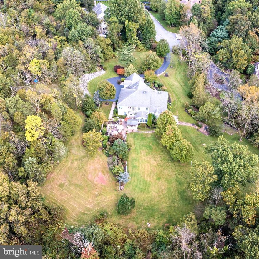 Welcome to 20 Beechwood Lane! This large, beautiful custom home situated on over 3 acres of land in Hershey is sure to amaze. The residence features 6 bedrooms, 5 full bathrooms and two half baths. Located at the end of a Cul de sac, this home is surrounded by nature and tucked into a quiet neighborhood. The imponent double front door welcomes you into the large foyer and its 12+ feet open space living room, with a custom multi glass window that extends on all the side wall of the room. This space features a private office, hardwood floors throughout and a large fireplace that is perfect for entertaining. Elegant wet bar splits the living room from the huge kitchen that is the heart of the residence.  The Kitchen features a large center Island, with sink and wine cellar, a large double door fridge, a custom 6 burner range with oversized professional hood, that can only be found in professional restaurants, and a magnificent showcase, where you may expose your most precious pieces. The luminous breakfast area opens to the exquisite backyard space with private stone patio, and luxurious custom-made barbeque/grill area surrounded by an impeccable Lanscaping, a personal Waterfall with a private pond and overall, a gorgeous outdoor fireplace. On the main level of the home, there is also the formal dining room area, that has a lovely custom glass sliding door entrance, and a bedroom, with private full bathroom. As additional areas of the same floor you may find, a second bedroom/ game room, a large laundry space, and a half bath. On the second floor all the 4 bedrooms have their own full private bathroom and feature different custom details, for example one of them has a private fireplace and skylight windows. The master bedroom is truly a beauty, with its warm welcoming colors, hardwood floors and tray ceiling. It features a private indoor balcony as well as an outdoor one, and on the opposite side of the indoor balcony, you may find the cedar closet, perfect for delicate items. The beautiful full Master bathroom has an oversized tile walk-in shower, a soak in bathtub and two split sink stations, all surrounded by vibrant details and elegant chandeliers. Basement is partially finished and used for entertaining with its own half bath. The unfinished portion of the basement is used as storage area that has been used also as workshop from current owner and features an additional outdoor access with garage to easily park bigger items or tools. The home has 3 attached garage spaces, as well as plenty of outdoor parking space, illumination and sprinkler system throughout the lot, plus a walking path for you to enjoy the outdoors. There are so many things to love about this residence, come tour today and make it your dream home.