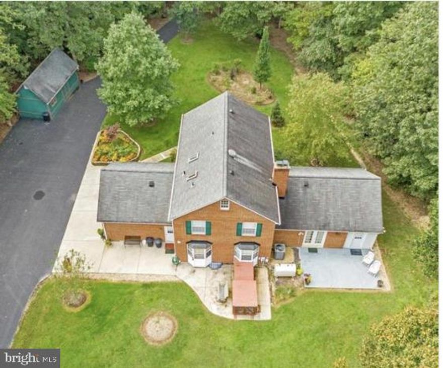 PRICE IMPROVEMENT!!!!ASSUMABLE 2.5% INTEREST RATE…..MOTIVATED SELLER!!!Welcome home! This beauty is nestled on almost 7 acres of privacy, located on the outskirts of La Plata, only minutes from the Charles county fairground, shopping ,schools and many restaurants. Enjoy living in a home that is maintenance free, to include a soaring front porch, over sized back patio, side load two car garage with work station, plenty of parking for your future family reunion, and a yard to die for, to include many blooms of fruit trees and grape vines. New HVAC as of 2018. Walk in to gleaming hardwood flooring and natural lighting through-out. Enjoy your eat-in country kitchen with stainless steel appliances and a formal dining room. The first floor hosts a home office or a secondary bedroom for your preference. The basement has plenty of flex area and hosts another bedroom or home gym. The upper level features an owner suite with two closets, one being custom build, bath and skylight. The hall bath has a skylight that compliments the other secondary bedrooms. There are so many thoughtful touches through out this home, it's a must see. A short trip to the Potomac River and local crab houses. Seller prefers CLA TITLE.