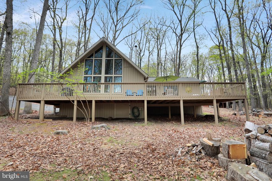 Wonderful fully renovated Elmwood model in The Woods Resort. Exterior is maintenance free with vinyl siding, and a large deck area for entertaining. Interior is completely remodeled with vaulted wood ceilings in the living room, including a wall of windows. And a nook for a futon for extra sleeping space. A full primary suite with bath, large closet and laundry facilities. Spacious kitchen with room for table. Upstairs is a loft area that will accomodate a couple of more beds. If you are looking for a weekend getaway in a wooded setting, you need to take a look at this property. There is no membership available so no extra initiation fee or annual membership fee. Just come and enjoy all this cabin has to offer. Most furnishings will convey.