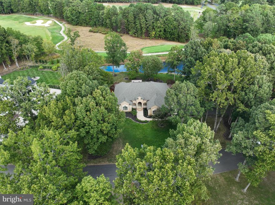 PRICE IMPROVEMENT!!!
Exceptional One-Level Living on the First Tee of Fawn Lake’s Arnold Palmer Signature Golf Course!

Arnold Palmer would be proud of this spectacular home, perfectly positioned beside a tranquil pond with sweeping views of the first hole. Designed for effortless main-level living, this former Coleman Homes model combines timeless elegance with thoughtful updates and modern comfort.

Inside, gleaming wood floors and expansive windows frame peaceful pond and course views. The spacious deck and beautifully landscaped grounds create a seamless indoor-outdoor flow.

Step into the grand foyer where natural light pours into the formal living room through a wall of windows. To the right, the gracious dining room connects easily to the chef’s kitchen with granite counters. The inviting family room features custom built-ins, a cozy gas fireplace, and sliding doors that open to a large Trex deck with a pergola and sunshade—perfect for relaxing or entertaining.

Enjoy true single-level convenience with the primary suite, kitchen, living, dining, and laundry all on the main floor. The serene primary suite offers a beautifully renovated, spa-like bathroom and generous closet space.

The lower level provides incredible flexibility, including two spacious rooms ideal for a gym, playroom, or hobby space—plus a family room, office, full bath, and abundant storage.

From the backyard, take in the peaceful pond views and enviable perspective of the course.

Life at Fawn Lake extends far beyond golf. This premier gated community features a 300-acre lake, pool, clubhouse, tennis and pickleball courts, sports fields, dog park, and even beach volleyball—offering a true resort-style lifestyle every day. Even better, this home includes a full golf membership transferable to the new owner at a reasonable price.

Don’t miss the opportunity to own this extraordinary one-level home in one of the region’s most sought-after neighborhoods!