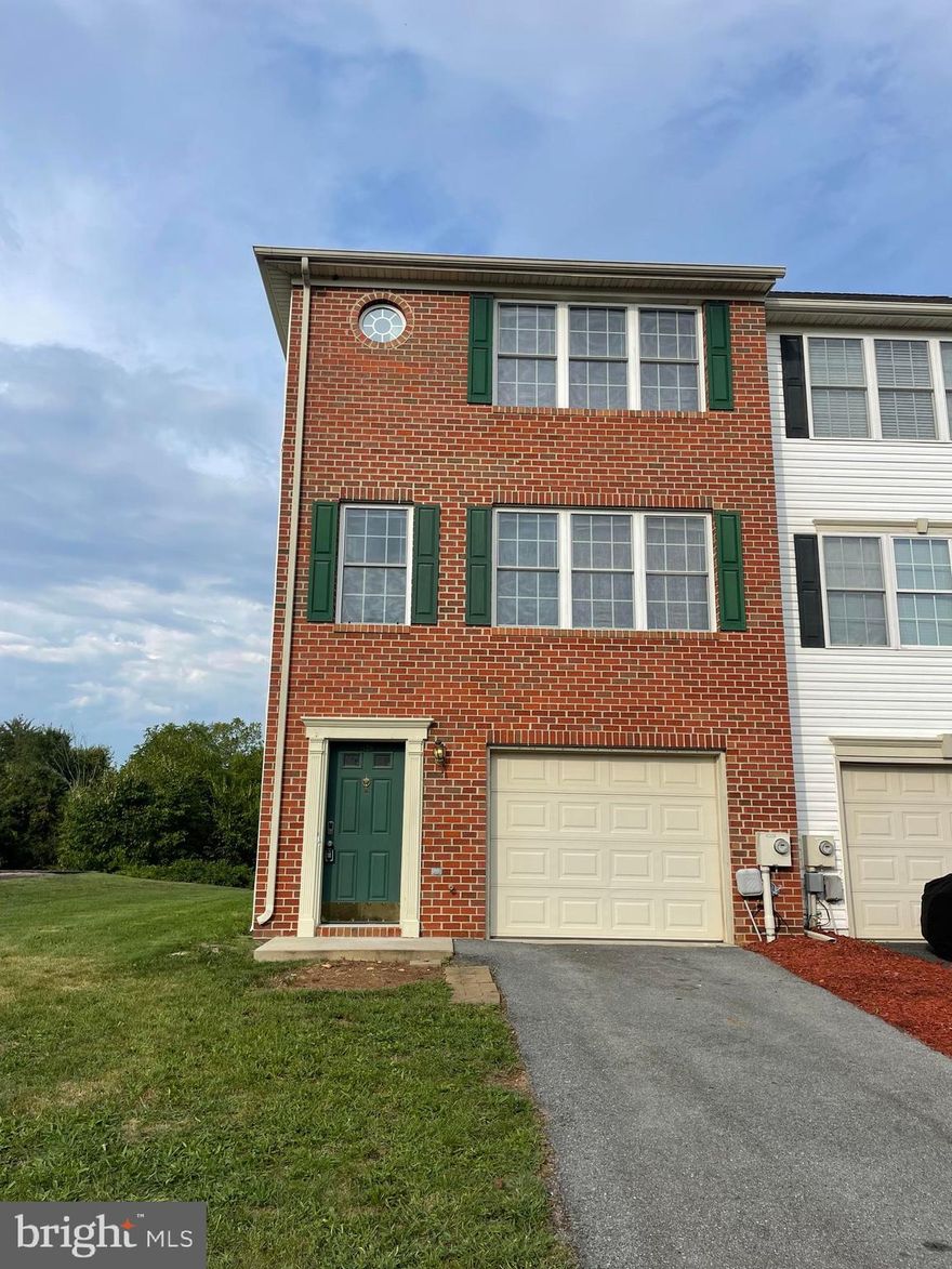 Available NOW. Here is your opportunity to rent this beautiful brick front townhouse in this sought after neighborhood.  This End-Unit townhouse sits next to a park and is walking distance to Spring Mills Elementary, Middle, and High Schools! With freshly painted walls and new floors, this large three level townhouse is your perfect new home! Offering a finished basement with a BONUS ROOM that could serve as a 4th bedroom and includes a walk-out to the back yard. The main living level has a wide-open floor plan with a half bath, eat-in kitchen that opens right into the large family room and also opens to the back deck. The owners' suite features an upgraded tray ceiling, walk-in closet, and ensuite bath. Two additional bedrooms share a hall bath. Schedule a showing today!