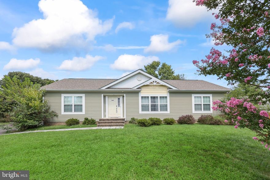 This charming 3-bedroom ranch offers a warm welcome with its open layout. The kitchen is a chef's delight, featuring stainless steel appliances, gas cooking, a large center island, and a wine refrigerator. The spacious primary bedroom includes a large en-suite with a dual-sink vanity. The backyard invites relaxation on a generous deck, ideal for entertaining. Additionally, the detached two-car garage doubles as a perfect workshop space. A true gem that blends comfort and style—schedule your tour today!