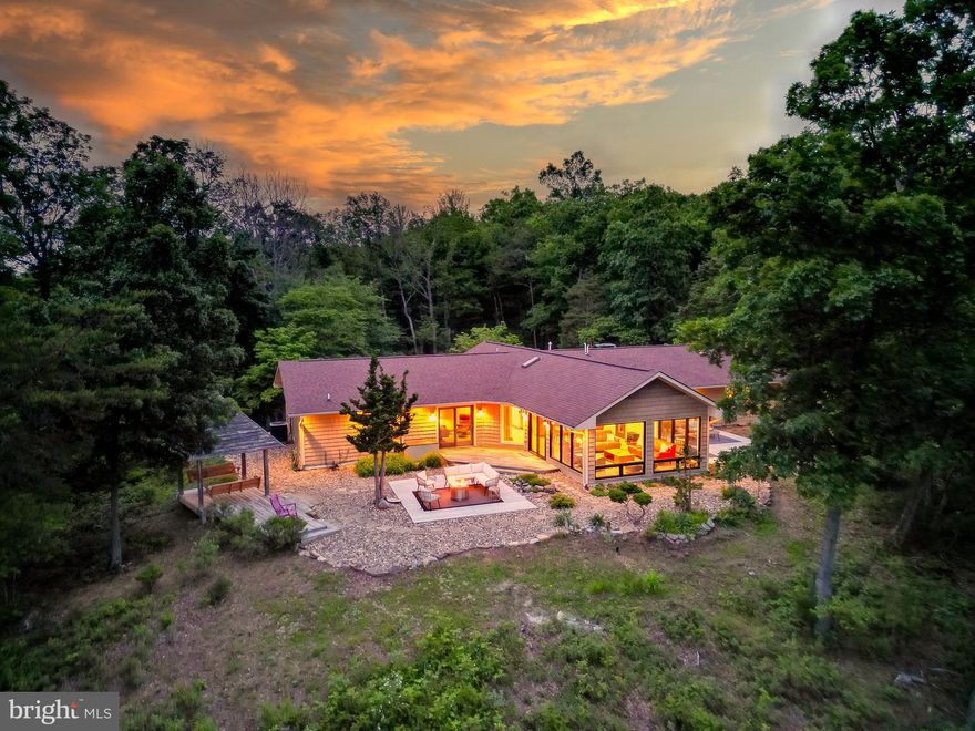 Mountain Oasis in West Virginia – One-of-a-Kind Property on 30 Acres!
Nestled in the breathtaking mountains of West Virginia, this one-of-a-kind, newly remodeled home is the perfect blend of modern luxury and serene mountain living. Whether you're seeking a peaceful primary residence, a vacation getaway, or a stylish space to host friends and family, this exceptional property checks all the boxes.

Key Features & Upgrades:
New Marvin Windows and Slider in the spacious family room, bringing the beauty of nature inside.
Brand-New HVAC System with propane heat (1,000-gallon in-ground tank) for year-round comfort.
New Tankless Propane Water Heater for efficiency and endless hot water.
Updated Kitchen Appliances: New dishwasher and propane range.
Freestanding Propane Fireplace Stove, perfect for cozy winter nights.
Modern Touches Throughout: New LED lighting, updated electric switches and outlets, and blackout blinds in the great room.
Whole-House Backup Generator ensures uninterrupted living.
Custom Interior Enhancements: Built-in bookcases, display cases, custom interior doors, and new sliding barn door to pantry.
Stylish Bathroom Upgrades with new fixtures.
Freshly Painted Interior with clean, neutral tones.
Two Brand-New Concrete Patios ideal for outdoor living and entertaining.
Extensive Landscaping: Over 15 tons of hand-placed river rock surrounding the home.
Pond Under Construction – your own water feature retreat in progress.
Security & Convenience: Front and rear doorbell cameras for peace of mind.
Spacious 2/3-Car Attached Garage with a dedicated workshop space.
Additional Highlights:
30 Private Acres – room to explore, hike, and truly escape the hustle and bustle.
Some Furniture Negotiable – move in with ease.

This is more than just a home – it’s a lifestyle. From the moment you arrive, you’ll feel the peace and tranquility that only mountain living can offer. Opportunities like this are rare. Don’t miss your chance to own this spectacular property.

Schedule your private showing today – your mountain oasis awaits!