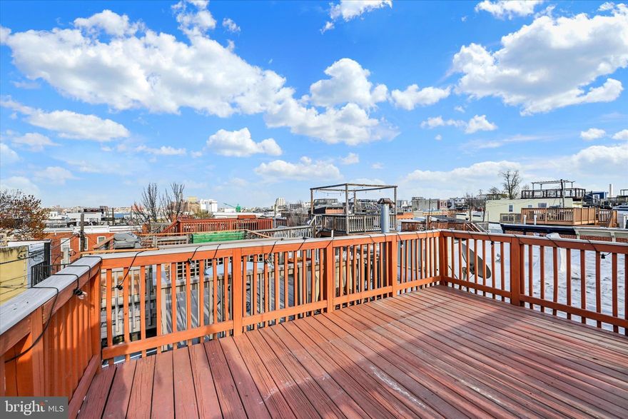 Rooftop views of the Baltimore skyline — completely rebuilt in 2016. Every major system is just 10 years old, including the HVAC, plumbing, electrical, and energy-efficient windows. This turnkey property features 2 beds + finished basement suite = 3 living levels with 4 baths. 
 
The main level is designed with an open-concept floor plan, preserving original hardwood floors while integrating a contemporary kitchen and a convenient powder room. The fully finished basement adds significant value, functioning as a third bedroom suite, media room, or home office with its own full bathroom and dedicated storage. On the top level, a private rooftop deck delivers unobstructed views of the Baltimore skyline and the Domino Sugar sign, making it a premier outdoor space.
 
Located just blocks from Federal Hill Park, the Inner Harbor waterfront, and local Riverside dining, 432 E Clement St is in one of the city’s most walkable and high-demand areas. Ask how you can get $3,890 back at closing!