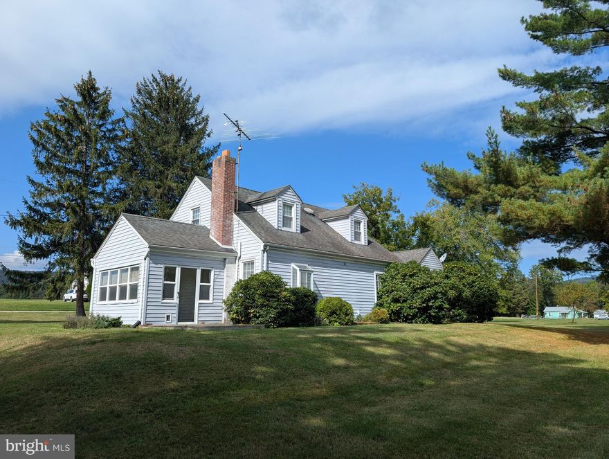 Quaint home on 1.5 acres in lovely setting walking distance to Fairfield borough. Hardwood floors, wood fireplace, 3 BRs, 2 Full BAs, sunroom and large 3 car detached garage/workshop. Lovely views from the sunroom and easy commuting to MD.  Hot water Oil heat and CAC.