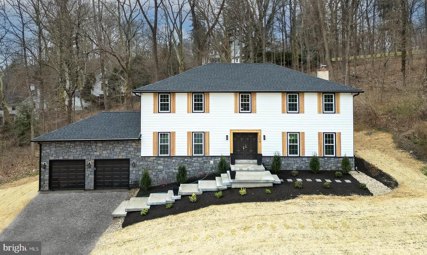 This is the renovation of your dreams. Set on a beautiful cul-de-sac in the heart of Bryn Mawr, this stunning single-family/fully property boasts over 5,500 square feet of finished space in the award winning Radnor School District. The home has undergone a total renovation, with an extensive list of luxurious modern updates and open living space providing 4,200 square feet of upstairs living + 1,3400 square feet of finished basement space making it the perfect balance of comfort and entertainment.
Situated high up on a cul-de-sac, surrounded by extensive new hardscaping and landscaping and an ultra-modern custom front stairway and gorgeous cedar shutters, this extraordinary home features 4 bedrooms and 3.5 bathrooms and customized designed, modern living throughout. Showcasing a number of upgraded designs, this home is accented with luxury engineered hardwoods, GE Cafe Appliances, a huge kitchen island and extensive natural lighting throughout the first floor. The expansive floor plan exemplifies modern living with two living areas and all new energy efficient windows.
Heading out through one of the two sliding doors, you'll be greeted by a brand new large paver patio and trex composite deck overlooking the private, recently expanded backyard surrounded by trees, ideal for indoor/outdoor entertaining. The first floor also features two living rooms, one with a wood burning fireplace and one off the kitchen.
Upstairs, the impressive primary suite includes multiple windows with plenty of natural light, a large walk-in closet and a primary bathroom with a huge glass door/walk-in shower, custom tile work, a bench and rainfall head in matte black finish plumbing. and a dual vanity. There are 3 additional huge bedrooms with one full bathroom on the top floor.
The massive basement is perfect for entertaining any number of guests with brand new carpet, a 3rd full bathroom and an 11 x 9 custom bar. The fully functional wet-bar area includes engineered hardwood flooring, seating for 5, large countertops and shelving for displaying your favorite bottles The entire basement features new recessed lighting and fixtures throughout. The home also boats all new plumbing and new electric, and a freshly blacktopped driveway.
306 Sandcastle Lane is the luxury renovation you've been waiting for. The home is perfectly situated just minutes from Villanova University and downtown Bryn Mawr, 10 minutes to Radnor High School and 15 minutes to the center of Wayne. Schedule your showing today.