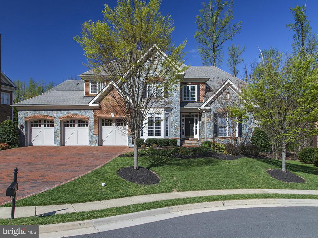 Stunning, fully light filled Estate on a premium Cul-de-Sac**4 sided Brick & Stone with 3 car garage w/ Spacious Brick Driveway**2 Story Lanai with outdoor FP**Trex Deck & Stone Patio w/Built-in Grill & TV**Huge Chef's Kitchen & Custom Basement Bar w/Wine Chiller & Full size extra SS refrigerator**Exercise/Media Room** Close to 495, 66, Metro, Tysons etc
