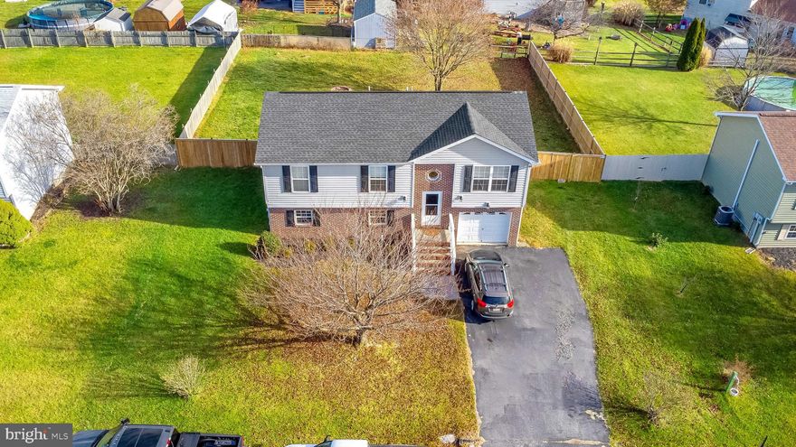 Welcome to your dream home, where comfort meets convenience in this 4 bed, 3 full bath residence. Nestled in a sought-after neighborhood, this property is ready for a new owner.   Step inside to discover a spacious, interior boasting LVP flooring that adds durability to the living space. Unwind in the lower-level family room, perfect for movie nights or creating a cozy retreat. The fully finished basement offers a bedroom that adds versatility to the living space. Outdoor enthusiasts will appreciate the fully fenced backyard, offering privacy and a secure area for relaxation or play. The attached garage provides convenience and ample storage space. Located in close proximity to schools and convenient shopping, this home offers both comfort and accessibility. Embrace the convenience of this prime location while enjoying the tranquility of suburban living. Don't miss the opportunity to make this property your own. Schedule a showing today and experience the comfort and functionality this home has to offer!