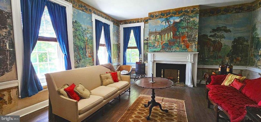 The Robert Worthington, Piedmont House - Complete with old-world craftmanship, modern amenities, stunning natural beauty, and endless possibilities for the future. Whether you’re seeking a family home, event venue, or a private retreat, this property provides a one-of-a-kind experience that seamlessly blends past with present. With its rich history and incredible location, the Piedmont House is truly a gem waiting to be re-discovered. 
Piedmont has been documented numerous times by historians as the most exquisite example of Georgian architecture in the state.  Sitting upon 29.08 serene acres just 1.5 miles from downtown Charles Town and 68 miles from Washington, D.C. Set back a ¼ mile off the main road, privacy is paramount, as the residence sits amidst ample woods, farmland, and rolling hills alike.
In around 1730, Robert Worthington obtained a grant from the Crown of England to settle in what was, at the time, Virginia. He completed the earlier house in 1735. This rustic, limestone portion of the home has an updated kitchen, bathroom, and bedroom suite with private entrance as well as direct access to the main house, perfect for a rental or in-law suite. The adjoined brick mansion was later built by Dr. John Briscoe in 1785. The home remained in the Briscoe family for centuries before being passed on to few other caretakers, including the late Jim Lehrer of PBS. 
Thoughtful improvements have been made over the years to blend historical significance with modern comforts. There have been upgrades to the central heating and cooling, electrical, and plumbing throughout. The two kitchens' feature granite and butcher block countertops, and new appliances and cabinetry. There have been updates to all of the bathrooms, the 3rd floor has been converted into a library, and a custom wine cellar featuring ebony marble flooring has been added to the basement level. The home features gorgeous original heart pine wood floors and millwork throughout, as well as a fireplace in every room.  
From the formal sitting room, featuring some of the earliest examples of wallpaper in America, to the master bath suite with copper soaking tub and fireplace, each room is a unique experience to be had.  The main floor features an expansive central hall with 12’ ceilings, a dine-in kitchen, a formal dining room with access to the garden, a sitting room, and a living room. Ascend the main stairs and you will find a bright and airy 25’ x 11’ living area adjoining the master and secondary bedrooms with 2 full baths. Upon reaching the third floor, you will find a cozy library with electric fireplace. The basement exhibits a finished entry way leading to the wine cellar, accompanied by ample unfinished storage spaces.
Step outside and you'll discover the 30' x 10' chicken coop and run (complete with 7 mature laying hens and 1 wild turkey friend), a fenced vegetable and herb garden, a full tennis court, fire pit, and riverside benches. There are multiple out-buildings including a large barn with finished floor, detached two-car garage, smoke house with electricity, pump house, and a derelict house far back on the property with lots of potential. 
The versatility of this estate is one of its greatest assets. Whether you are looking to create a homestead for your family or an event venue for weddings and celebrations, the Piedmont house offers the perfect setting. Alternatively, for those seeking a quieter lifestyle, the property’s unique location provides the perfect sanctuary. The expansive property allows for the cultivation of gardens, raising livestock, and keeping horses. With its serene setting, thoughtful design, and connection to the natural world, the Piedmont property offers an exceptional opportunity to live a life of peace and luxury amidst a piece of early American history. 
Ecological relevance: The land is diverse in plant and animal life. There is a relationship with nature conservancy to preserve this important habitat.