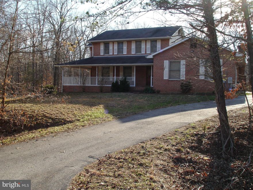 Estate Sale*A Great value this all brick home*Granit counters*Stainless steel appliances*large u shape kitchen work area w/breakfast nook*butlers pantry*step down family room w/brick fireplace & built in book shelves*hardwood floors in LR&DR*sep washroom*walkout Basement w/Br &Bath sitting on 2 acre lot*large wrap around porch & deck*2 car g w/paved circular driveway*NO HOA*NO Hassle*just peace&Q!