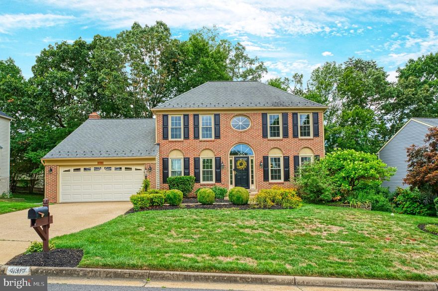 This meticulously cared for elegant Virginia brick colonial is situated in sought after Brittany Neighborhood. The welcoming two-story foyer greets you with hardwood floors which are found throughout the main level and up to and including the upper level hallway. This move-in-ready home features neutral paint and updated light fixtures. You will find the inviting living room has a large bay window and flows seamlessly to the dining room, which offers both a bay window and a full-length double window. 
The spacious kitchen, is the heart of the home. It comes complete with plantation shutters, granite countertops, a double-door pantry, and an expansive island. Recently replaced appliances include a new stove and microwave. Don’t miss the convenient desk space for homework. Enjoy meals in the breakfast nook, enlarged by a full bay window overlooking the back yard. 
The family room boasts cathedral ceilings, a brick, gas fireplace, framed by Palladian windows, skylights and a rear wall of windows with transom windows and French doors opening to the deck. The enormous mudroom/laundry room provides extra storage and a rear foyer to the home.
Upstairs, the four bedrooms feature upgraded carpets and ceiling fans. The spacious primary suite includes a walk-in closet, dual vanities, a separate shower, and a soaking tub.
The expansive, finished walkout basement, offers a third full bath, a large rec room, a bonus room/non-conforming bedroom, and plenty of storage. Newly replaced French door leads to the back yard and provides privacy with plantation shutters. The fenced backyard provides an ideal outdoor space for entertaining or pets. You will find beautiful mature plants blooming year round in this thoughtfully landscaped, but easy to maintain yard. Most windows have been replaced, Furnace replaced 2015, hot water heater 2011, siding & garage door 2011, Roof 2008. 
 Brittany is a neighborhood of cul-de-sacs surrounded by Prince William National Forest with walking paths and trails throughout. Brittany Neighborhood Park at Brittany entrance has basketball, tennis, volleyball, commuter parking and more. Commuter bus pick-up at Brittany entrance with other commuter options nearby. Golf/Pool/Tennis memberships available. Fortuna Center Plaza just across Dumfries Rd with other shopping and dining options nearby.