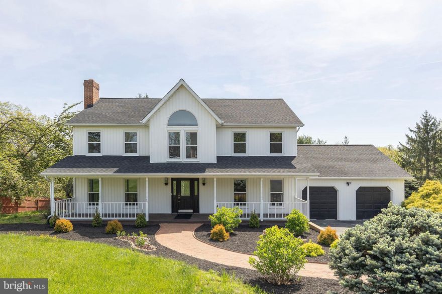 Meticulously Renovated Colonial on 2.15 Acres with In-Law Suite & Smart Features

Welcome to this exquisitely renovated 4-bedroom, 4.5-bath Colonial in the prestigious Spring Hollow Estates. Set on a private 2.15-acre lot, this nearly 5,000 sq ft residence blends timeless architecture with high-end modern upgrades—just a couple minutes from I-81 and the vibrant town of Woodstock.

Renovated to an exceptional standard, this home features hardwood flooring across all three levels, elegant tilework, custom millwork, and refined lighting throughout. The main level includes formal living and dining rooms with crown molding and chair rail, a sunlit living room centered around an unused brick fireplace, and a designer kitchen with quartz countertops, smart stainless steel appliances, and abundant natural light.
Upstairs, the spacious primary suite offers a spa-like bath with a freestanding soaking tub, glass-enclosed shower, and marble-topped dual vanity. One additional bedroom includes a private en-suite bath, while two more bedrooms share a third full bath—perfect for family or guests.

The fully finished walk-out lower level features a complete in-law suite with a kitchenette, full bath with marble vanity, private laundry, and its own entrance—ideal for multigenerational living or flexible accommodations.

Step out from the family room onto a maintenance-free composite deck with peaceful easterly views. The backyard backs to mature woods and enjoys exceptional privacy with no neighbors on two sides.

Key Features and Recent Upgrades:

New energy-efficient windows throughout

New roof, heat pump, and water treatment system with two new hot water tanks

Smart switches, USB outlets, and Google Nest thermostats

Smart appliances and 4-camera Ring security system

Oversized 2-car garage with new garage door opener and decorative flooring

Extensive mechanical improvements throughout

This move-in-ready home delivers space, quality, and smart living in one of Woodstock’s most desirable neighborhoods