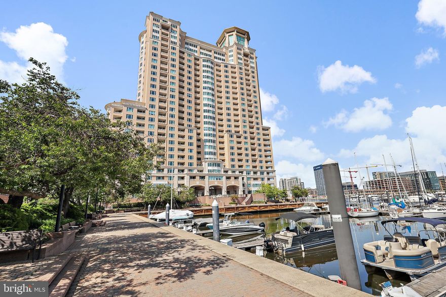 Exceptional Waterfront Luxury Condo with Unmatched Views and Exclusive Amenities!  Experience resort-style living at its finest in this spacious 1-bedroom plus den waterfront condo, offering views of the Harborview Marina and the iconic Domino Sugars. With its open design and exquisite details of custom wood accents, crown molding and specialty lighting, this home combines comfort, style, and convenience. The gourmet kitchen, upgraded features, and spacious main suite make it the perfect retreat. The main suite bath features dual bowl sinks, a jacuzzi tub, and a stall shower.  The den, with its private balcony, offers the perfect space for relaxation if used as a second bedroom, or working privately if used as an office. This exceptional condo boasts numerous upgrades, providing a comfortable living experience. Two assigned gated garage parking spaces! Additional spaces can be rented. Resort-Style Amenities Include:  24/7 front desk concierge service, Outdoor grill area, stylish social lounges with billiards, Business center, conference rooms, elegant banquet rooms, Bike storage and a state-of-the-art fitness center which includes both steam and sauna rooms, Indoor and outdoor pools, perfect for year-round relaxation.  Beautifully landscaped gardens, walking/jogging paths, picnic benches, and tranquil fountains throughout the community, Gated garage parking and on-site security staff for peace of mind.  Located just moments from the vibrant Inner Harbor,  downtown business district, gourmet restaurants, both stadiums, commuter rail, and only 9 miles to BWI Airport, this condo offers the perfect balance of serene living and ultimate convenience.  Live where luxury meets lifestyle. Don’t miss out on this rare opportunity—schedule your tour today and make this resort-style condo your new home!