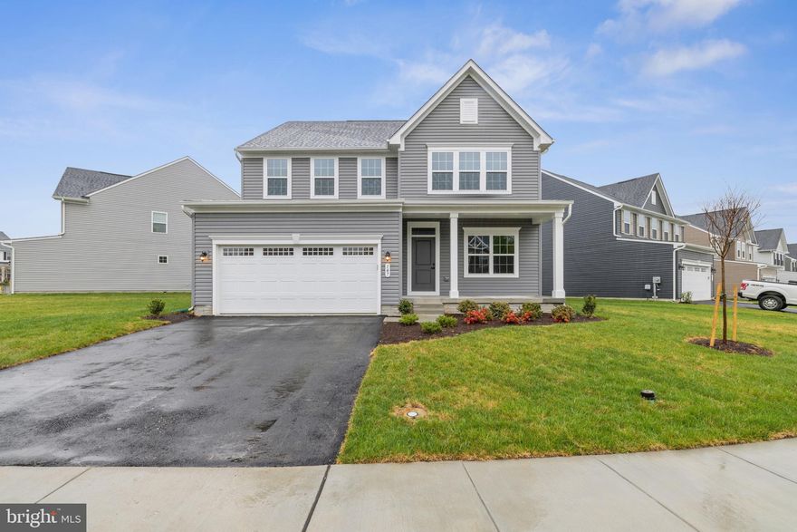 Welcome to this IMMEDIATE MOVE IN Columbia at the highly desirable Martinsburg Lake community! Get up to $5,000 in closing cost assistance with the use of the seller's preferred lender! The Columbia single-family home is just as inviting as it is functional. Discover a magnificently spacious floor plan with a finished basement and included appliances! The welcoming family room effortlessly flows into the gourmet kitchen and dining area, so you never miss a moment. The kitchen features beautiful granite countertops, a huge island, stainless steel appliances, and white cabinets. You'll have direct access to your covered porch from your dining space, this outdoor living area is the perfect spot for entertaining and relaxing. Downstairs, use your finished basement however you please and enjoy a full bedroom and bathroom! Upstairs, you'll have the open concept loft space, two extra bedrooms and extra bathroom, your conveniently placed laundry room, and your primary suite.  Your luxurious owner's suite offers a giant walk-in closet, spa-like double vanity bath, and soaking tub.  Come home to The Columbia today. Less than 10 minutes from I-81, 20 minutes to Hagerstown. Enjoy the beautiful views and amenities that the Martinsburg Lakes have to offer!