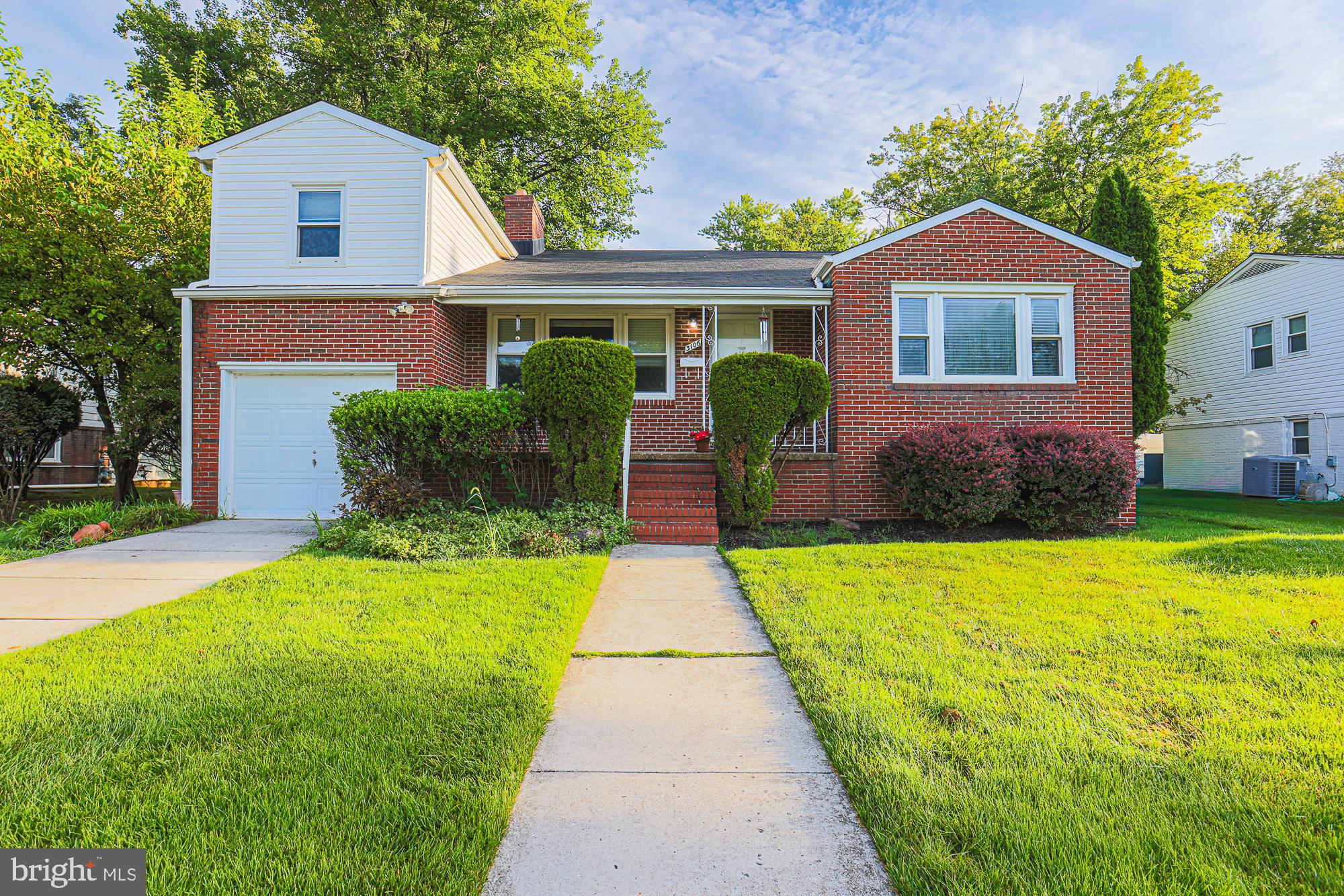 Beautifully maintained 3 level split in the heart of great county location. Front porch, attached garage, beautiful level yard, hardwood floors, primary bedroom with enlarged bathroom including steam shower, soaking tub, open kitchen, finished lower level with gas fireplace, built ins, laundry and half bath.