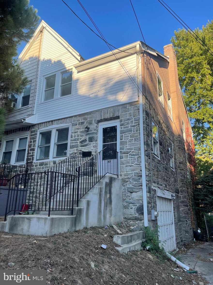 Investor Alert! Great 2 unit property, 3 bedroom 1 bath on top 2 floors and 1 br 1ba on lower level with walkout garage.  Stone and brick building, fireplace, hardwoods, some rooms partially updated and waiting for flooring to go down.  Driveway,  attached garage and rear yard.  Being sold in as-is condition