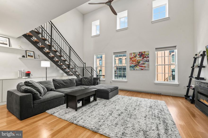 Welcome to 1610 N Queen St at Gaslight Square, a spacious two-level penthouse offering 1,882 square feet of luxury living between Rosslyn and Clarendon. This exceptional residence features direct elevator access, an open-concept floor plan, soaring 18-foot ceilings, hardwood floors, and a gourmet kitchen featuring premium Wolf and Sub-Zero stainless steel appliances.

The home features two spacious primary bedroom suites, each with a walk-in closet and its own full bath, along with a convenient main-level powder room. Two tandem parking spaces in the secure underground garage add to the home's exceptional convenience. A private rooftop terrace provides the perfect setting for outdoor entertaining, gardening, or simply relaxing while enjoying views of the Washington Monument.

Ideally situated less than half a mile from both the Rosslyn and Courthouse Metro stations, Gaslight Square offers unparalleled access to shopping, dining, and everyday conveniences. Georgetown is just one mile away across the Key Bridge, while the dynamic Rosslyn-Ballston Corridor provides an abundance of restaurants, entertainment, parks, and recreational opportunities.

Combining luxury finishes, exceptional outdoor space, and a premier location, this residence presents a rare opportunity to experience sophisticated penthouse living in one of Northern Virginia's most desirable urban communities.