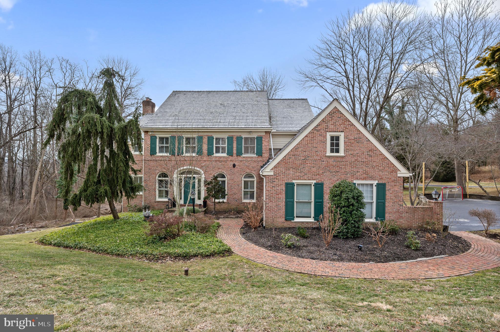 This exquisite brick colonial is nestled in the heart of Radnor Township, sitting on a generous 0.90-acre lot in a wonderful neighborhood known for its sense of community and tranquility. This property offers the perfect blend of classic charm and modern amenities with its beautifully designed spaces and sun-drenched interiors. The first floor boasts a bright and airy atmosphere, with an open layout that seamlessly connects the living spaces. The open kitchen is a chef's delight, leading into a step-down family room featuring a stunning fireplace, perfect for cozy gatherings. The living room is adorned with expansive windows that overlook a large deck and lush outdoor space, ideal for entertaining. A brand new mudroom/laundry room offers convenience and modern touches. This level also includes a dedicated office space, perfect for remote work or study. The upper level features an extra-large master bedroom suite, complete with his and hers walk-in closets and a ensuite bathroom. There are two more generously sized bedrooms on this floor, each with its own ensuite bathroom. The lower level is truly special, with approximately 1,800 square feet of living space. Sunlight floods this area, making it inviting and vibrant. This level includes another family room area, a playroom/workout room, and a large bedroom with a full ensuite bathroom. Additional spaces are available to tailor to your needs, whether it's a home theater, office, or craft room. This home is located in a highly sought-after neighborhood within Radnor Township, known for its excellent schools and vibrant community life. Ithan elementary has been ranked #1 elementary school in state of Pennsylvania. The spacious lot provides ample privacy and outdoor enjoyment opportunities. Showings Begin: Thursday, February 27th at 11 AM. Pictures will be available before the showings begin, offering a sneak peek into this magnificent property. Don’t miss the opportunity to make this beautiful colonial your forever home!