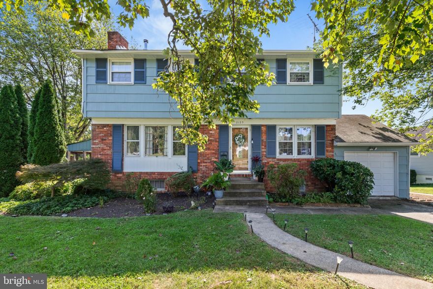 Welcome to 2125 Folkstone Road!
Located in the Fountain Hill community of Lutherville Timonium, this beautifully maintained split-level home has been thoughtfully updated and is completely move-in ready.
Recent upgrades include fresh interior paint throughout, updated trim work, refinished main-level floors, a new bathroom vanity in the primary suite, and new tile flooring on the lower level and basement. The exterior has also been repainted from its original white to a beautiful gray-blue color that enhances the home’s curb appeal and complements the surrounding landscape.
Main Level - 
The entry opens to a bright and inviting living room centered around a brick wood-burning fireplace, with large windows that fill the space with natural light. The adjoining dining area sits next to the kitchen, creating a comfortable flow for everyday living or entertaining. The floors on this level have been sanded and refinished, adding warmth and a fresh, polished look throughout.
Second Level – Primary Suite
Just up from the main floor, the spacious primary suite features an attached full bath with an upgraded vanity and a walk-in closet. This level serves as a private retreat, thoughtfully separated from the additional bedrooms.
Third Level - 
The uppermost level offers three additional bedrooms and a full hall bath, providing ample space for family, guests, or a home office setup.
Lower Level & Walkout Area - 
The lower levels have been updated with new tile flooring, providing a clean and modern finish. The large family room features a wood stove, its own HVAC zone, and a convenient powder room. French doors open to a newly added side balcony that extends from the porch, allowing both sets of doors to open directly to the outside—creating a seamless indoor-outdoor connection ideal for relaxing or entertaining.
Basement & Systems - 
The basement provides flexible space for storage, laundry, or utilities. The home is equipped with a gas forced-air furnace with three zones and central air conditioning for year-round comfort.
Exterior & Location - 
Situated on a corner lot, the property includes a one-car garage, off-street parking, and an inviting outdoor layout with multiple access points to enjoy the yard and patio areas. The combination of modern updates and timeless charm makes this home an exceptional find in one of Timonium’s most convenient neighborhoods, close to commuter routes, shopping, and top-rated schools.