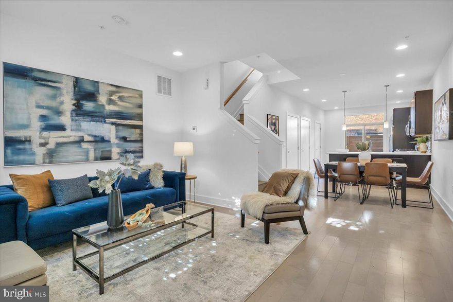 Modern 3 bedroom, 3.5 bathroom Northern Liberties townhome with 2 CAR off street PARKING, located in the highly desirable Northern Liberties neighborhood. This home has an abundance of space, finished basement, rear fenced yard, roof deck and 2 assigned off street parking spots! The light-filled, open concept main floor has plenty of room to entertain. From the large living room and separate dining space to the fully upgraded kitchen with stainless steel appliances, quartz countertops, custom backsplash + large peninsula and private, rear fenced yard you won't want to leave this urban oasis! The second floor offers two graciously sized bedrooms with large windows and generous sized closets, two full baths. The primary suite is located on the third floor and features a spa-like ensuite bath with floating vanity, beautiful tile work and a glass enclosed shower. The gorgeous primary bedroom also has two large walk-in closets with built-in storage! The home also features hardwood floors and tile throughout and a pilot house with wet bar and beverage center which leads to a large roof deck with amazing views. Completing the home is the laundry area with full sized, front load washer and dryer. All square footage numbers are approximate and include above and below grade measurements. Square footage should be verified by the buyer. It is the responsibility of the buyer to verify real estate taxes.