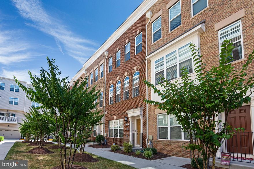 Experience refined living in this exceptional four-level townhome within the highly sought-after Metropolitan community.
The entry level welcomes you with a private ensuite bedroom, full bath, and direct access to the two-car garage a perfect blend of convenience and comfort.
Available November 10th!
The main level boasts a light-filled open floor plan, where a spacious living room flows seamlessly into a gourmet kitchen featuring premium stainless-steel appliances, a large center island, granite countertops, and designer cabinetry with abundant storage. Gleaming hardwood floors extend throughout, creating an elegant and cohesive aesthetic.
Upstairs, the third level offers three generously sized bedrooms and two full baths, while the top-level retreat impresses with a private primary suite, spa-inspired bath, an additional living area, and an expansive rooftop deck ideal for entertaining or enjoying sweeping views.
All just minutes from the University of Maryland, Greenbelt Metro, major commuter routes, upscale shopping, and fine dining.
This is luxury townhome living at its finest.
Contact us today for a private showing!