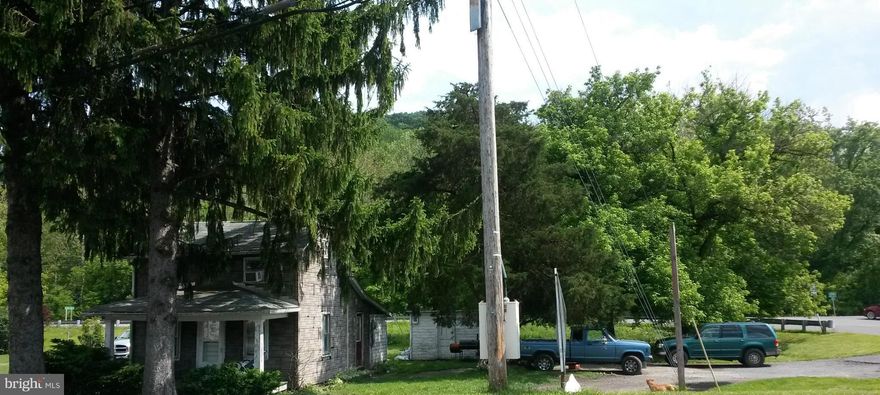 Corner lot situated across from Corriganville Sheetz. House currently rented. Needs work. Hi traffic location. Other potential possibilities.