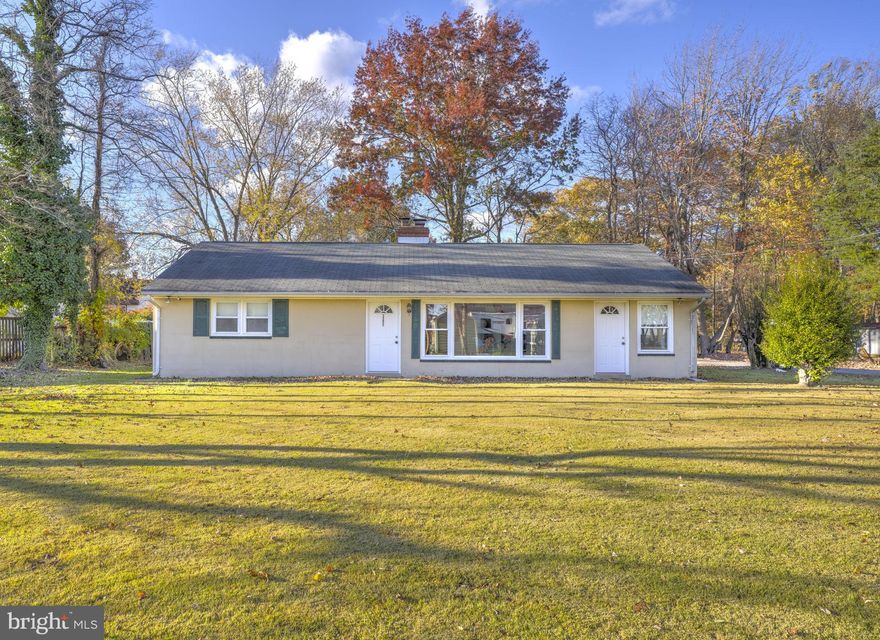 Showings on 2/28 from 11-2:45 only. Nestled on a spacious lot across from stunning million-dollar waterfront homes, this property offers endless potential. The home needs a bit of TLC, but its charm and possibilities are undeniable. Enjoy a bright, sun-filled living room featuring a large picture window with views of the bay, plus a cozy woodstove for those cool evenings. An additional bonus room off the living area—with its own exterior entrance—makes an ideal home office or creative space. Out back, you’ll find a versatile workshop or office area complete with a covered patio, perfect for projects or relaxation. Take a leisurely stroll along the Chesapeake Bay, or spend your afternoons fishing and crabbing from the community pier. Experience the ease of one-level living and imagine the possibilities—make this home your own coastal retreat!