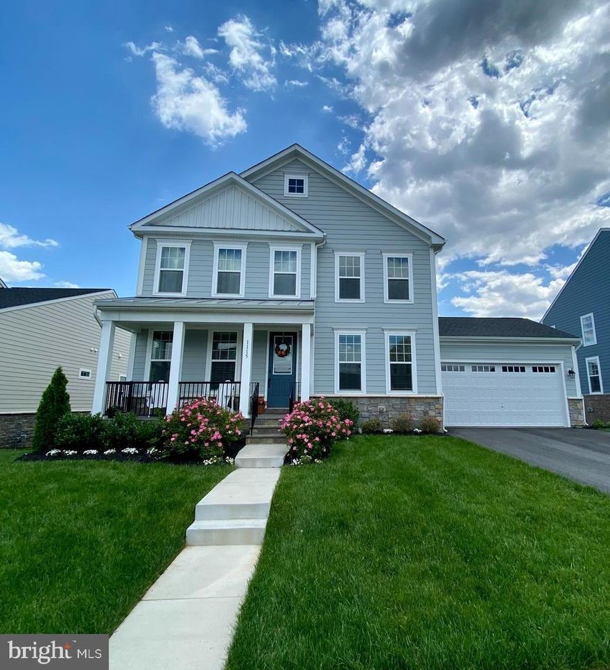 Absolutely Stunning 4 bedroom, 2.5 bath home with welcoming front porch and 2 car garage!  This home was built in 2019 and features a beautiful custom designed kitchen with a huge island below designer lighting with room for seating!  Stainless steel appliances, double wall ovens, cooktop and large farmhouse sink!  Additional dining area and living room details include an open floor plan, gas fireplace l and lots of windows letting in natural light!  Huge deck is off the main level with plenty of space for outdoor dining and entertaining! Four bedrooms on the upper level with a large owner's suite that just has to be seen!  Soaring ceilings, row of windows and a large owner's bath!  Unfinished lower level has lots of storage space, an additional refrigerator and a walk out into a large backyard!  Seasonal lawn mowing with bi-annual lawn treatment included!  Pictures taken before tenant move in.