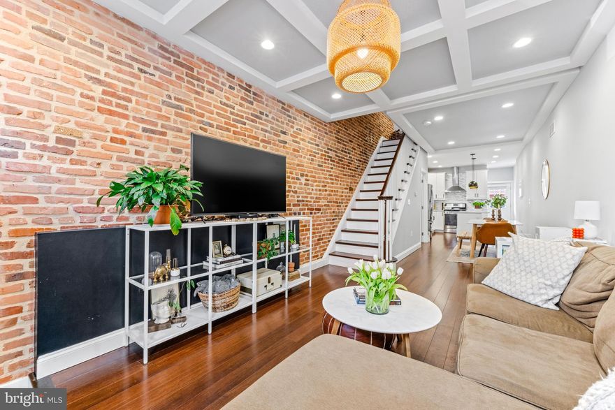 Open House Cancelled. This stunning, fully renovated row home offers 3 finished levels + roof top deck w/ unobstructed city skyline and Patterson Park views. Huge plus is an OFF STREET PARKING PAD but the owners also say on street parking is always easy here! Inside you will be so impressed with all the details and extras throughout from the incredible light fixtures, perfectly repointed brick walls, gorgeous marble countertops in the kitchen, tray and coffered ceilings, and more! The owner's bedroom is really the perfect set up being generous in size, built in shelving, large closets, and a dreamy ensuite bathroom - huge double sink vanity, walk in shower w/ beautiful tile work and a frameless glass door. The second bedroom is also a great size w/ trey ceilings and exposed brick walls. The roof top deck is accessed in the hallway (not through a bedroom). The basement is fully finished w/ full ceiling height - 1 bedroom, 1 full bathroom, and another additional den room currently used as storage. Major Savings w/ 5 Year Left of CHAP Tax Credit - This is a historical tax credit in place on this property that will transfers to new owners. Please reference the credit in place on the recent tax bill. Instead of paying $8,715 a year in taxes, your tax liability is only $3,770 for 2024. This saves you over $400 a month on your monthly payment compared to similarly priced homes in the neighborhood. This also means the house underwent a full gut renovation in 2018 so all the major systems (HVAC, hot water heater, plumbing, electric) are 6 years young! Located less than 30 second walk to Patterson Park - imagine being able to walk your dog to Patterson Park dog park or playing in a kickball league within mins of your front door. Also directly across the street is the #1 city charter elementary school - Hampstead Hill Academy. Don't miss out on the opportunity to buy this gem - even the outside is gorgeous with repointed brick, black door and window trim and built in black flower beds!