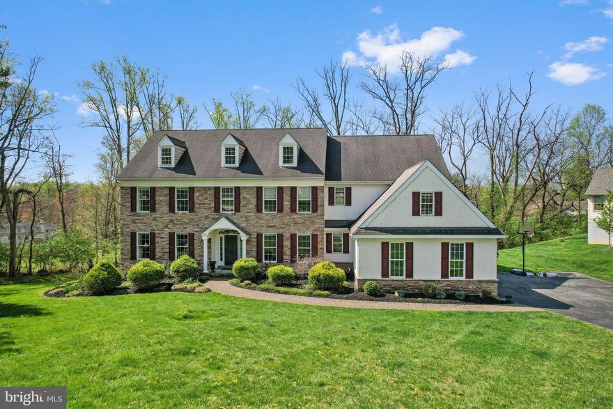 Rare opportunity to own in one of the most coveted cul-de-sacs in popular Uwchlan Township / Downingtown East School District! 202 Painswick Lane offers a wonderfully open layout with ample space for relaxing/working at home and entertaining family and friends. This spacious, upgraded home features over 4700 square feet of living space plus a huge unfinished walkout basement with 9' ceilings and full daylight just waiting for your finishing touches. The stunning exterior features a stone facade, wide-plank hardiboard siding on both sides and throughout the rear, and a portico over the front door. The seller added an expansive Trex deck that walks down into the private rear yard. Upon entry through the front door, you'll find a gracious foyer with a stylish light fixture, wainscoting and natural light all the way to the rear of the home. The formal living room in the front of the home connects via French doors to a home office with built-in cabinetry.  Adjacent to the formal powder room, this area could be converted into a large in-law or guest suite on the main level. To the right of the foyer is the formal dining room with wainscoting and oversized crown molding. Continue into the spacious kitchen, with a large center island with pendant lighting, a double oven, granite countertops, a tile backsplash, a range hood with pot filler, a coffee/wine bar and a walk-in pantry. Behind the kitchen is a spacious breakfast room with glass doors leading out to the deck. The kitchen opens to a huge family room with vaulted ceilings, a propane fireplace and access to the rear staircase. There is also a family entry hall with doors providing access to both the driveway and the 3-car garage. This area also includes  a secondary powder room and a dedicated mudroom with storage cubbies and a coat closet. Recently refinished hardwood flooring runs from the foyer into the dining room, kitchen, family room and breakfast room. At the top of the main staircase is the large owner’s suite with two walk-in closets and an ensuite bathroom. Dual vanities, a linen closet, a water closet, a separate tiled frameless shower and a soaking tub complete this luxurious space. On the other side of the home at the top of the rear staircase you'll find a loft/bonus room which could be used as a secondary office or a playroom/kids' zone. There are 3 additional bedrooms, one of which is a princess suite with a private bathroom. The other two bedrooms share a connected "Jack and Jill" bathroom with a double vanity. Don't miss the walk-in closets in each of the upstairs bedrooms, one with a finished bonus space behind it. Additional upgrades abound throughout including light fixtures, millwork, professional landscaping, exterior lighting and more! This home is conveniently located in Uwchlan Township, very close to the brand new Uwchlan Hills Elementary School, Lionville Middle School and Downingtown East High School. It is also convenient to Whitford Country Club, the Lionville shopping area on Uwchlan Avenue and Route 100 and Restaurant Row and ACAC Fitness in the Eagleview Town Center. You'll find easy access to routes 100, 30, 202 and the Pennsylvania Turnpike. All this in the award winning Downingtown Area School District (East), home to top ranked STEM Academy. Don't miss this stunning home!