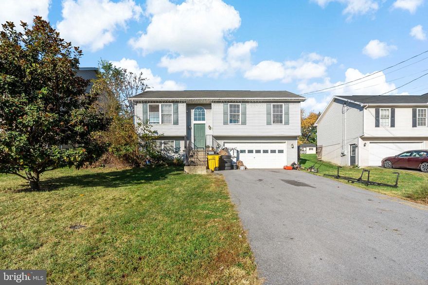 Split-level home features 3 bedrooms and 2 baths, along with a spacious 2-car garage. The half-finished basement offers a family room with laundry room. Outside there is a fish pond and waterfall. Property is fully fenced. Conveniently located near RT9, RT11, and I-81, as well as shopping options.