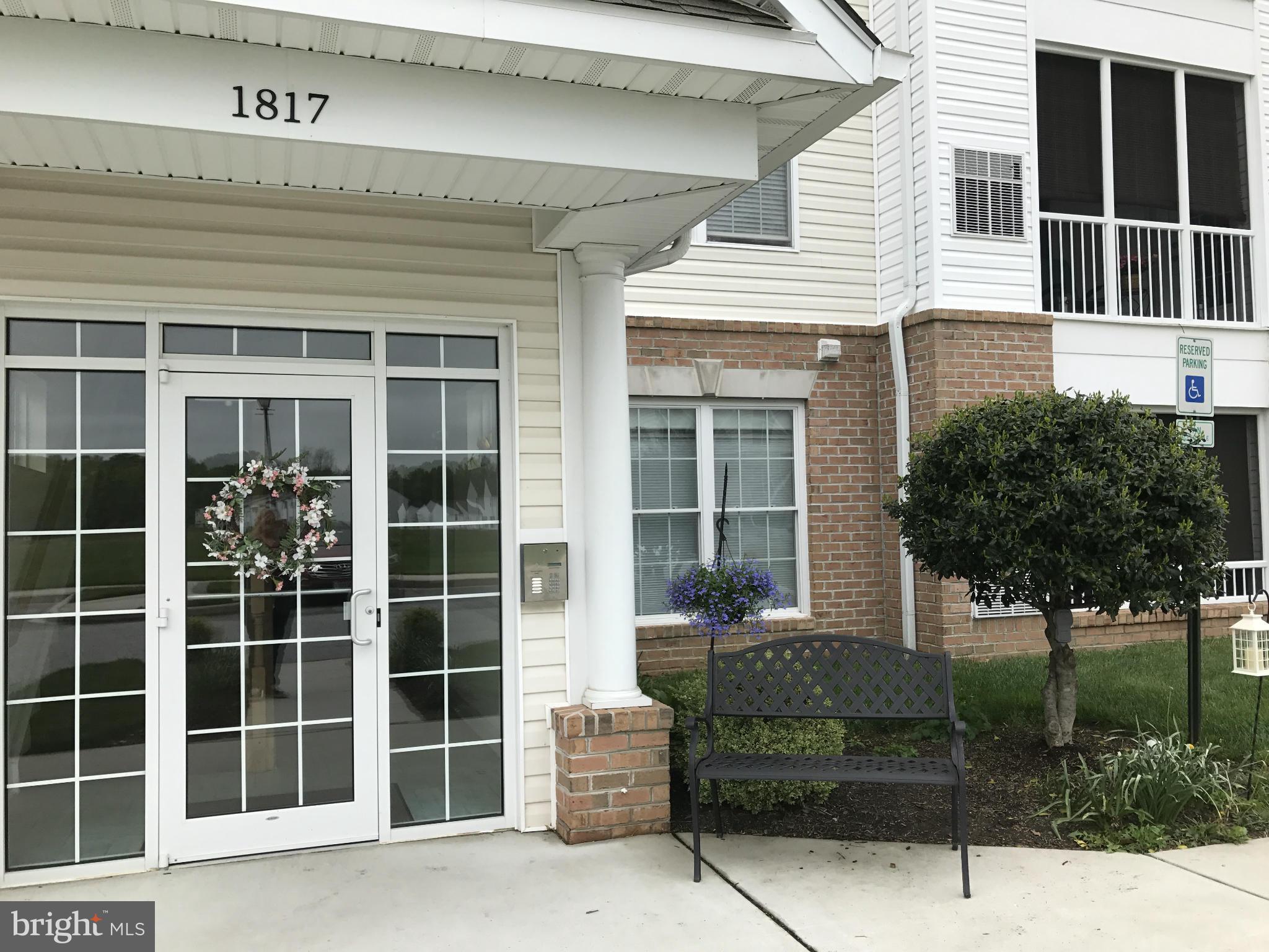 Pristine & Shows like New, 2 Bedroom 2 Full Bath, Elevator 55 and older community. This spacious condo features- 9 ceiling, crown & chair rail molding, wood floors throughout - open kitchen with center island, breakfast bar, open floor plan, screened balcony backs to woods. Community Pool, Health club and Pavilion, close to shopping**Carefree living for 55+ Elevator Community