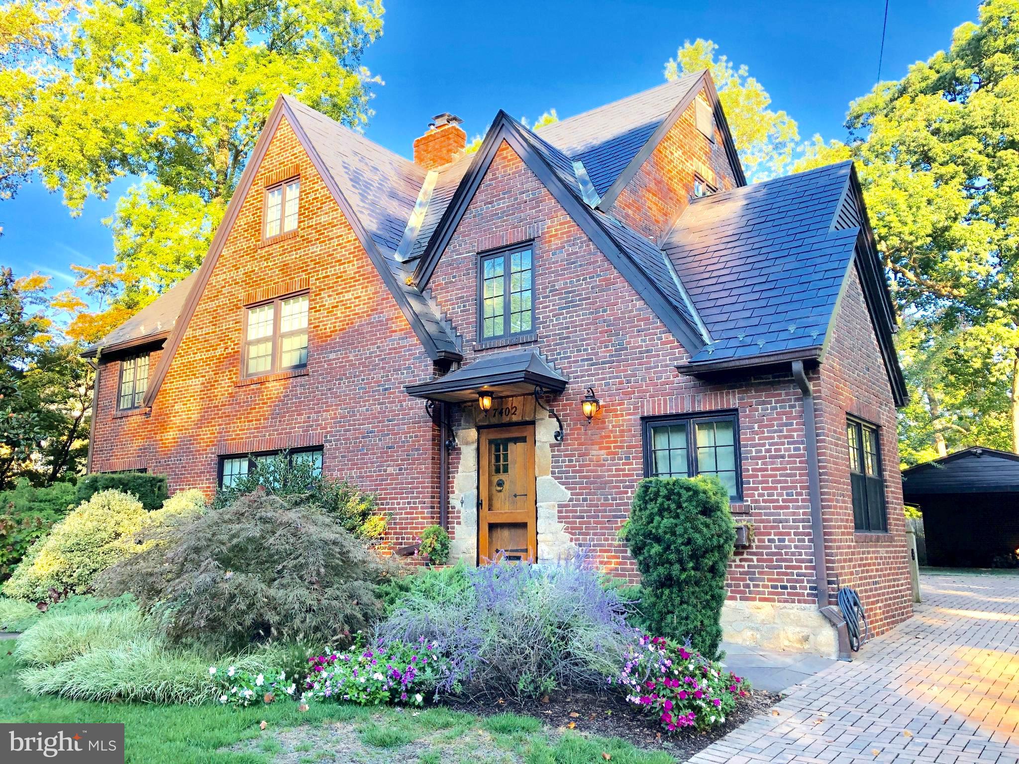 ***Open Sunday, Feb 9th, 2-4pm!*** Exceptional NEW price! Experience the masterful luxury & elegant design in this recently restored Tudor Revival Style residence. This one-of-a-kind, four level home is designed with attention to detail & crafted with an abundance of fine finishes that offer elegance and modern comfort. Its sophisticated design was carefully selected to honor the original architecture along with embracing the exceptional outdoor spaces. Its beautiful design is evidenced by distinctive ceiling moldings with raised relief squares, fifty-two, historically accurate, casement windows & doors (by Marvin) that frame exceptional views of the grounds coupled with an inviting floor plan that is perfect for entertaining. The top-of-the-line culinary kitchen is equipped with premium finishes and professional appliances. All bedrooms feature en-suite baths, and welcomed natural lighting. Enjoy the magical expansive rear gardens complete with a vaulted ceiling screened-in porch, generous stone patio, grilling pavilion and the convenience of a multi-zone irrigation system. Drive up on the cobblestone paver driveway to the two-car carport (with attached storage compartment) with additional space on the driveway to accommodate 2 vehicles. Located on the grand and picturesque Meadow Lane, the home stands proudly within professionally landscaped, lush grounds on a prime and scenic 10,700+ square foot lot. ***Note: In the event further expansion to the residence is desired, the deep, wide glorious lot affords great flexibility for a myriad of possibilities!!***. This is your invitation to enjoy all the amenities of the sought-after Town of Chevy Chase, the close proximity of the vibrance of downtown Bethesda, the Bethesda Metro, theatre, award-winning B-CC schools, parks, trails, and the convenience to all three major airports and highways.