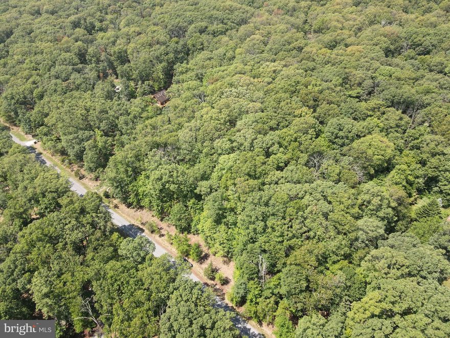 This 3.02 acre lot offers a perfect location to build your dream home or vacation getaway in the woods, with a very usable gently sloping lot. On a well maintained gravel road just off the main paved roads. Private community River access and amenities, situated within the gated River Ridge community, the property benefits from protective covenants ensuring your peace of mind.

Enjoy exclusive access to community amenities including  showers and restrooms, picnic benches and grills, and secure kayak storage so you can leave your kayak right down by the river and enjoy your private community access within your gated community! With amenities like that you can spend all day at the river!  Embrace the peaceful surroundings and make this your personal haven.

Buyers please note, it is a gated community and you won't be able to drive by without an agent to show.