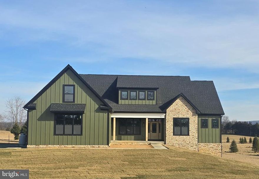 April 20th Delivery! Experience the perfect blend of modern comfort and natural beauty in this brand-new, open-concept farmhouse home. This unique residence features a four-bedroom, four-and-a-half-bathroom floor plan, designed for both privacy and entertaining. The spacious main level includes an open living area with a cozy gas fireplace. The primary bedroom, with its en-suite bath and convenient laundry room, half bath and three additional bedrooms and a full baths, providing a private space for family or guests. Situated on a private, wooded 3.5-acre lot, this home provides a serene escape. Residents of Lake Forest Estates enjoy exclusive access to a beautiful lake with a fishing dock, a basketball court, a picnic pavilion, and the Appalachian Trail. A 2 car garage and full basement with full bath included in the additional 1200 finished square feet completes this exceptional property. This home is perfect for commuters.