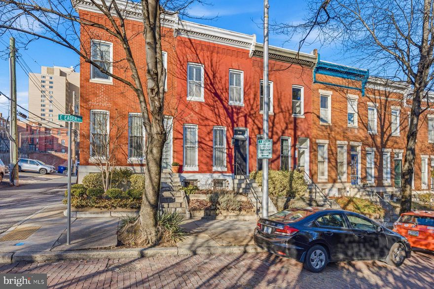 Victorian charm abounds in this spacious and well-appointed townhome ideally located in the heart of Mount Vernon. Offering nearly 1,700 square feet of living space (excluding the unfinished basement), this residence beautifully blends historic character. Original high ceilings, crown moldings, and hardwood floors throughout create a timeless elegance. The main level features a gracious living room, formal dining room with fireplace (new liner 2021), and a generously sized kitchen with stainless steel appliances, ample cabinetry, and abundant counter space—perfect for everyday living and entertaining.
Upstairs, you will find three large bedrooms with generous closet space and a fully renovated bath. Both bathrooms have been tastefully remodeled, and the home is equipped with one-zone central air conditioning and heating, new in 2021. The gas hot water heater was also new in 2021.
The fenced rear patio provides a private outdoor retreat ideal for entertaining or relaxing. Additional highlights include private permit parking and excellent proximity to major conveniences, including easy access to I-83, Johns Hopkins University, neighborhood restaurants, grocery stores, and walking distance to Penn Station. A wonderful opportunity to enjoy space, character, and location in one of Baltimore’s most desirable historic neighborhoods.