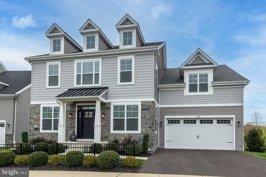 This pristine 4 bed 4 ½ bath colonial in Bucks County's Warwick Mill community. This stunning residence, built by Ryan Homes, features rich hardwood floors, neutral paint throughout, and countless luxurious upgrades. The entrance foyer is flanked by spacious formal living and dining rooms, and hardwood floors continue back to the stunning family room with gas fireplace. Open to the designer kitchen, which offers the cook an oversized island with seating, granite counters, tile backsplash, stainless appliances, Butler’s pantry, and adjacent sunny breakfast area. Access the spacious two-car garage through the convenient mud room. Up the hardwood staircase, the spacious primary bedroom features a tray ceiling, sitting area, enormous walk-in closet with dressing area, and gorgeous en suite bathroom with granite vanity, double sinks, large stall shower, and separate water closet. Three additional bedrooms are generously-sized with ample closet space. One of the bedrooms is en suite, while the other two share a full bathroom accessed from the hallway. The full-sized laundry room with utility sink is conveniently located on the second floor. More living space may be found on the beautifully finished lower level, which includes another full bathroom. In all four seasons, the expansive Trex deck will suit all your entertaining and relaxation needs. Enjoy award-winning Central Bucks School District. Easy access to nearby dining, shopping and commuter routes.