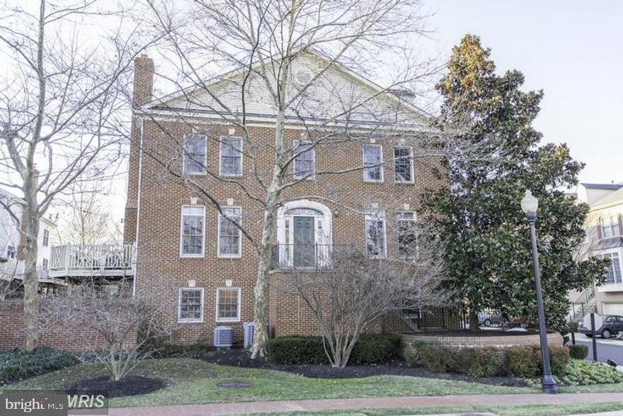 Large, stunning, brick front End Unit Townhome with 2 car garage. Gleaming HW floors, beautiful detail throughout home. Gourmet eat- in- kitchen  with SS appliances & granite countertops. Large family room off kitchen, plus additional family room on lower level. Perfect house for entertaining. Located in close- in Fairfax City, walk to George Mason University, Court House, restaurants, shopping. Commuters dream, close to 66, Rt 50 & metro.