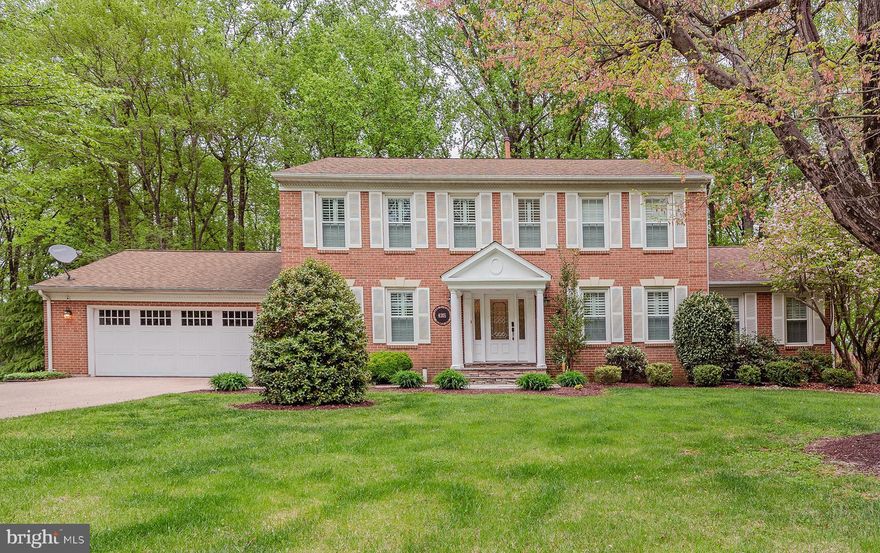 This stunning home combines comfort and elegance in a prime location.  Features include a Kitchen with updated stainless steel appliance, granite counters, and high end cabinetry * New Plantation shutters throughout * All new interior paint * Lawn  Irrigation system * Spacious custom screened porch overlooks private backyard with lush landscaping * Fully finished lower level with generous rec. room, full bath, optional 5th bedroom/office, workroom, and abundant storage * Complete overall of the electrical system * Hardwood floors throughout * Main level laundry with newer washer and dryer * This home is turn key!