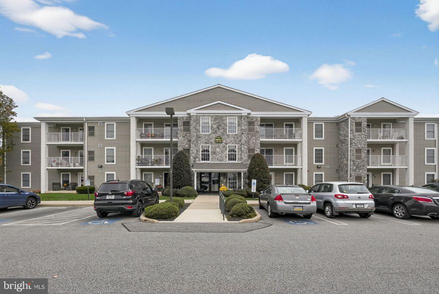 Welcome Home to The Greens at Westover! Step into Unit #402, a pristine recently updated 2-bedroom, 2-bathroom ground-level condominium offering 1,054 sq. ft. of stylish, low-maintenance living in one of Montgomery County’s most desirable 55+ communities. Built in 2003, this beautifully maintained open concept flat unit blends comfort, convenience, and scenic charm — perfectly situated across from Westover Country Club with peaceful golf course and wooded views. Located in Building 4, just steps from the elevator, this unit offers the ideal combination of accessibility and privacy. Inside, you’ll find a bright, open concept living and dining area featuring fresh paint throughout, new wood laminate flooring in the living room, dining room, kitchen, and both bathrooms, and new carpet in the bedrooms. The kitchen boasts modern cabinetry, well maintained appliances, and pristine countertops, ready for all your cooking needs. Enjoy your morning coffee or unwind after a long day on your private patio overlooking the golf course.  The spacious primary suite includes a large closet and an updated ensuite bath, while the second bedroom is perfect for guests or a home office. A second full bath, in-unit laundry, and ample closet space add to the home’s appeal. A new hot water heater (installed November 2025) provides peace of mind for years to come. Building 4 offers wonderful amenities including a library, social room, fitness area, and secure storage. The community itself features a clubhouse, indoor pool, and direct access to the Schuylkill River Trail—perfect for walks, bike rides, or simply enjoying the outdoors. Don’t miss your chance to live in this sought-after community. Schedule your private showing today! *Some photos have been virtually staged*