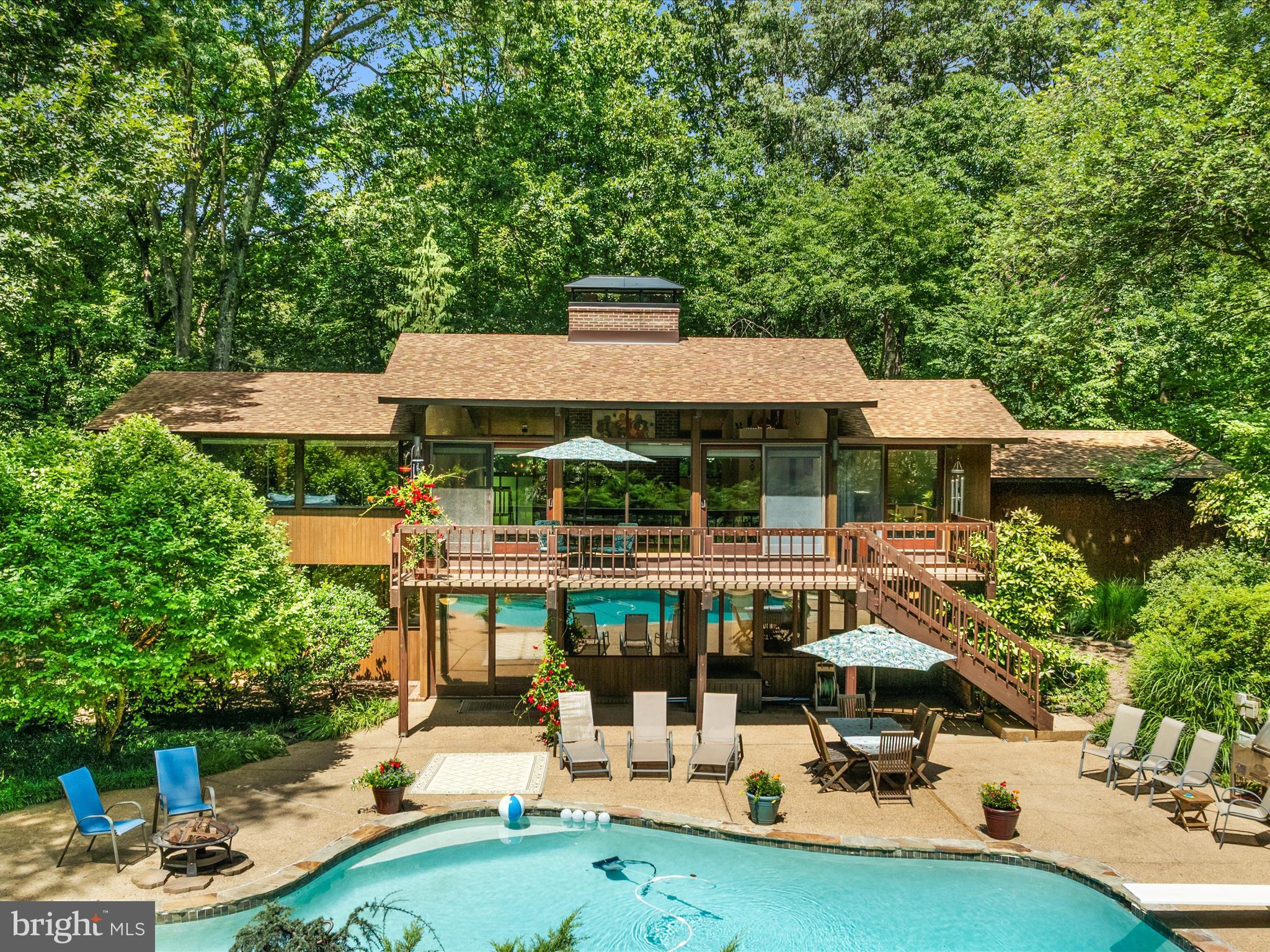 >>>ONE OF A KIND UNICORN FIND<<< Mid-century modern architecture design authentic DECK HOUSE with 4,200 sq ft of space. "Windows are framed in mahogany and the floors and ceilings are crafted with tongue-and-groove cedar decking. Large windows and sliding doors throughout the home help bring the outside in."
Hidden Oasis on VERY PRIVATE 1.2 ACRE LOT in highly sought after Dulles Tech Corridor! A magical place with freeform HEATED POOL | Gated, Fenced Rear Yard PLUS open grassy Play Area behind fence! Enjoy Nature Views from all windows | Sliding Glass Doors to Deck w Stairs to Yard | Brick and Red Cedar Siding. 2 Car Garage with shelving + workbench | TWO story SHED with 15.5’ x 11’ footprint | EV/RV 120V 30A charging outlet. SMART HOME features for toggle switches, lighting, designer window shades, security features. FIVE Skylights | Vaulted Beamed Wood Ceilings through main level | Hardwoods and terra cotta Tile flooring. NEW ROOF in 2020 | Natural GAS for Tankless Water Heater, 2 fireplaces, cooking, and pool heater. Energy saving Ground Source GEOTHERMAL Heat Pumps installed in 2016 for cooling and heating reduced utility bills by as much as $500/month. Private Serene Location on cul-de-sac street just minutes to extensive shopping options plus metro Silver Line and Dulles Airport. This home is included with Equestrian Park Subdivision with direct access to trails in Lake Fairfax Park. Option to purchase recreation passes for Reston Association network of pools, tennis courts, and pickleball courts. Longtime owner has ongoing contracts for pool, pest, and systems maintenance. Abundance of INFORMATION available in Documents Section.
