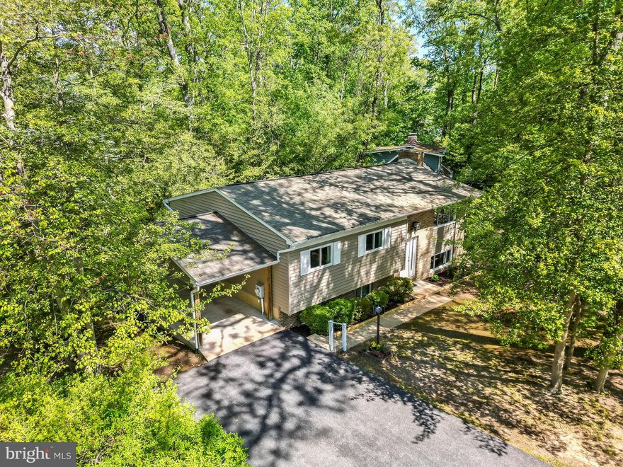 Arden on the Severn — a rare opportunity in a highly sought-after waterfront-lifestyle community on the Severn River.

Lovingly maintained by its original owner, this charming 3-bedroom, 2-bath split foyer sits on a 0.28-acre corner lot in Section 5, just a short walk to one of Arden’s five private community beaches.

Recent updates include a brand-new roof, new water heater, basement waterproofing with sump pump, and more — providing peace of mind and value for the next owner.

The main level offers a sunlit living room, dining area, kitchen, and three bedrooms, including an owner’s suite with private bath. A second full bathroom serves the main living areas. Off the dining room, a rear deck overlooks a peaceful, tree-lined backyard — perfect for morning coffee or evening cookouts.

The daylight lower level features a spacious family room, laundry, two oversized storage rooms, and walk-out access to the yard. A covered carport offers convenient parking and shelter from the elements.

Arden on the Severn is renowned for its vibrant waterfront lifestyle, offering residents exclusive access to beaches, boat ramps, playgrounds, and scenic spots for swimming, kayaking, and crabbing.

Don’t miss your chance to live in one of Crownsville’s most desirable neighborhoods!