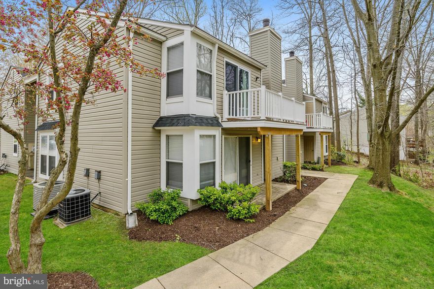 Enjoy the heart of Columbia off of Hickory Ridge! Centrally located, this beautiful condo features a tastefully redone interior w/ a modern, eat-in kit, appointed w/ SS appls, opening to the sun-bathed living rm hosting a WB fireplace & balcony walk-out. The master boasts a custom walk-in, lux  bath & sep balcony walk-out. Updates include kit, top-of-line bathrooms, flooring, roof, siding & more!