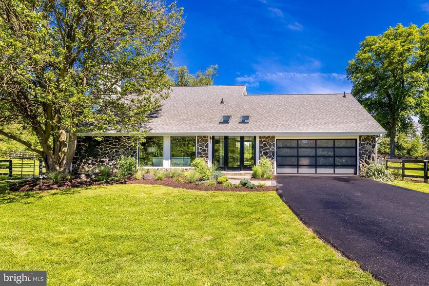 Broker's Open this Thursday, 4/11, from 11am-1pm. Offer deadline Monday, 4/15 at 2pm. Seller does reserve the right to accept an offer prior to the deadline. Rare opportunity to purchase the personal residence of renowned interior designer, Lauren Liess! Property Collective proudly presents 256 Bliss Lane, a modern horse country masterpiece in the heart of Great Falls, Virginia. Situated on 2 bucolic acres and fully renovated, the home enjoys gorgeous pasture views from every room on the main level. This equestrian property walking-distance to L’Auberge Chez Francois includes a three stall horse barn with electrical, a tack room, storage room, horse fencing and trailer entrances.

The exceptional interior has been completely reimagined in Lauren Liess’ signature down-to-earth design style while enhancing all of the home’s vintage charm. Renovations have been completed by Carrmichael Construction with the highest standard of quality craftsmanship and finishes - A chef’s kitchen by Unique Kitchens and Baths with natural quartz counters and top of the line appliances, Lauren Liess x Well-Born Wright UV European hard wax finished wide plank white oak floors as well as hand-selected designer lighting, tile and fixtures - many from Lauren’s various product lines and collaboration.

The floor plan is set up for a busy and elevated lifestyle where function matters as much as form and everything is where it feels like it should be. The result is a 3 level home that encourages a simpler way of life that is in touch with nature while organized for ease and low-maintenance living. The family room opening up to the massive patio and the outdoor bar with a pass-through kitchen window are unique and thoughtful features that allow for effortless entertaining. Bedrooms and living spaces offer flexibility and room to grow as your family needs evolve.

Located in the desirable Langley High School pyramid and minutes to Tysons Corner, I-495 and the GW Parkway, this is true lifestyle property in the heart of Great Falls. All major systems updated and well replaced since 2021. Welcome home!