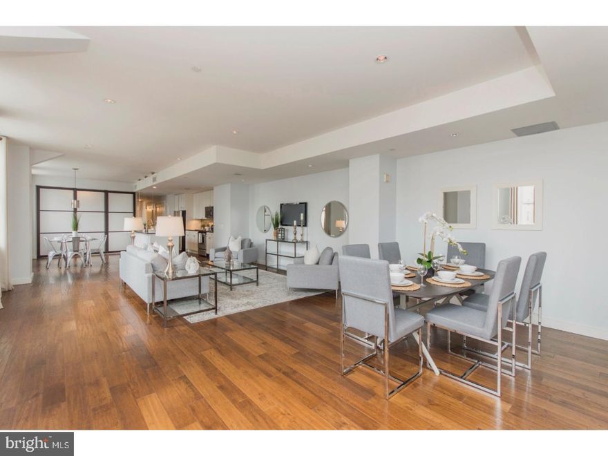 Welcome home to luxury living at the historic Packard Grande Building. This expansive two bedroom + den, two bath residence features over 1,700 square feet of living space, stunning city views, and is truly one of a kind. The living and dining areas offer 9 foot high ceilings, gorgeous hardwood floors, and oversized windows which flood your space with an abundance of light. The gourmet kitchen boasts sleek modern cabinetry, stainless steel appliances, gleaming granite counters, and a convenient breakfast bar. A large master suite features southern and eastern exposures, and access to the upgraded spa-like master bath, with an oversized frameless glass shower. The second bedroom is generously proportioned and features good closet space. The large den can be closed off to the living area, and is perfect as an additional guest room, home office, or play room. A 24-hour concierge, state of the art fitness center, roof deck with stunning city views, lounge, and in unit laundry, complete this deluxe home at the Packard Grande. Valet parking is available at a nearby garage. Perfectly situated in the Rittenhouse Square/Avenue of the Arts area, this home is just steps away from fine dining, one-of-a-kind shopping, world-renowned cultural destinations and exciting nightlife.