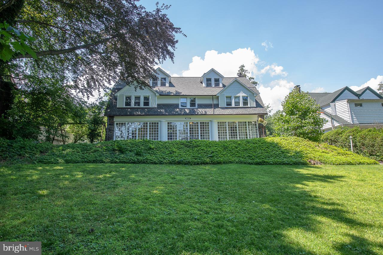 One of a kind historical home on a beautiful street in the coveted Bala Cynwyd neighborhood of Lower Merion. Sitting up on the hill, it is well positioned with curbside drama and old world sophistication.105 Edgehill Road was originally built approximately 115 years ago as part of Miss Roney's Finishing School for Girls. Then it was converted into a private residence in the mid-1940's. Totaling 3,658 square feet with six bedrooms and two full and two half bathrooms, each room of this house showcases original architectural details and character enhancements. Drive down the private driveway to the detached garage with pool accommodations and separate apartment. There is easily parking for six cars right in back of the house. Enter into the conservatory with character windows then foyer with grand staircase and leaded glass windows which opens to the formal dining room and living rooms. In the living room are beautiful built-ins, a gas fireplace, and french doors to blue stone terrace. The magnificent kitchen is an entertainers dream, featuring a large picture window, custom wood cabinetry, granite countertops, upgraded appliances. The open kitchen has ample space for an oversized dinner table and access to the back stairs and powder room. Off the kitchen is access to the blue stone terrace with wisteria arbor looking over the expansive back yard with secluded pool. The second floor of the home has four bedrooms all offering great closet space, updated hall bath and the laundry room with powder room. The third floor has two huge bedrooms and a hall bathroom with claw tub and separate stall shower. There is an unfinished basement, perfect for storage, with an outside entrance, canning cave (could be a wine cellar) and cedar closet. The private backyard features mature landscape. Convenient to the train, public transportation, schools, parks, restaurants, and houses of worship. An exciting opportunity in Lower Merion Township offering a lot of house, a lot of land, and a lot of charm...