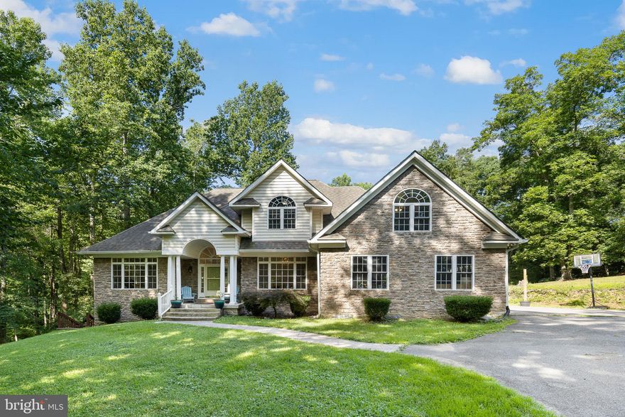 Beautiful custom home with stunning renovation throughout only a short distance from the Rappahannock River and the reservoir in  Colonial Forge School district. Main level master bedroom plus an additional bedroom on the main level.  A 6th bedroom in the basement (ntc).  Beautiful windows that let in loads of natural light highlighting the fabulous renovations.  Sapphire color kitchen cabinets with champagne fixtures that compliment the butcher block countertop of the kitchen island, commercial gas cooking range with faucet and range hood and under cabinet microwave.  Dining nook with built in bench seats in the most tranquil hub of the home. Beautifully updated bathrooms and master with modern version of the claw foot tub.  Lovely tall vaulted ceilings in the main living room with shiplap and an electric fireplace.  The family room opens onto the rear deck overlooking the 4+ acres of privacy.  There are three additional bedrooms on the upper level.  All new flooring throughout, new paint throughout.  The basement has a fabulous recreation room opening onto a side deck area.  The pool table stays. Stamped concrete walkway and 2 sheds.  Circular driveway and plenty of room for parking.  Pets on a case by case basis.  Don’t forget the reservoir at the end  of West Rocky Run Road.