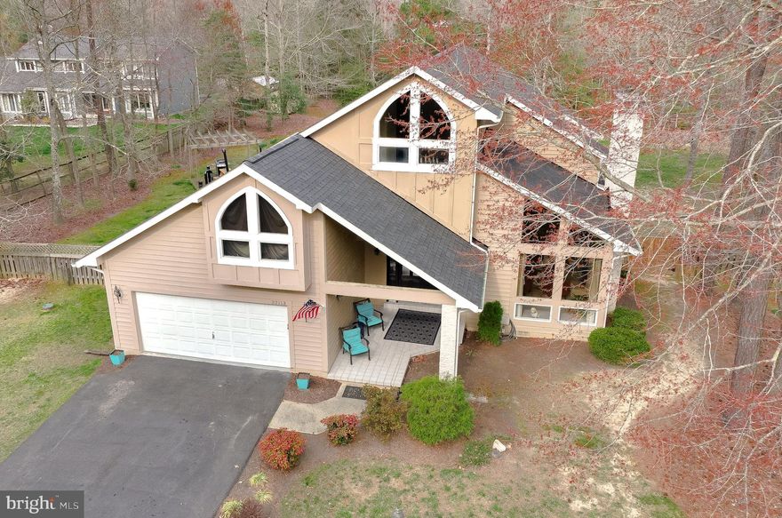 Welcome to your new home at 22113 Philip Drive, nestled in the coveted Mulberrys of Breton Bay – a contemporary home with 4 bedrooms, 3.5 baths, and a relaxed vibe. A BRAND NEW ROOF WITH ARCHITECTURAL SHINGLES AND NEW GUTTERS and newer septic.  This home also comes with an assigned DEEP WATER BOAT SLIP on highly sought after Breton Bay! This home is not your run-of-the-mill cookie-cutter residence; it's all about individuality and a GREAT lifestyle. Step inside to an open layout that seamlessly connects the living, dining, and kitchen areas. Large windows flood the space with natural light, showcasing the sleek design. This home has great flow, featuring 2 bedrooms on the main floor with 1.5 baths and 2 bedrooms upstairs, each with a private full bath for added comfort and convenience. You'll appreciate 2 large family rooms, perfect for entertaining or enjoying cozy nights in – whether you're snuggled up by the fireplace, gathered with loved ones, or hosting a great party. Upstairs, the 2nd-floor loft adds versatility, ideal for a teen hangout or a quiet home office space. Enjoy hosting summer cookouts on the deck and in your expansive, fenced-in yard – a flat and perfect spot for your summer crab feasts and BBQs. There is plenty of room for an in-ground pool! If you're not keen on adding a pool, no worries! Just around the corner, there's a community pool where you can join for a membership fee, ensuring you have the convenience of a pool without the hassle of upkeep.  A short stroll down the hill, and you'll be ready to hop on your boat and explore the amazing Southern Maryland waterways. Enjoy community perks like tennis courts and boat storage. For golf enthusiasts, the popular Breton Bay golf course is just around the corner. Plus, it's a quick 10-minute drive to Leonardtown, where you'll discover shopping, dining, a wharf with a playground, public dock, bakeries, and cozy coffee shops. This home is all about simplicity, convenience, and a great lifestyle. Leonardtown Schools! Ready to make it yours? Schedule a tour today!