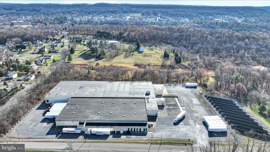 Over 127,9000 square feet of food grade warehouse space in excellent condition.  Approximately $35.00 PSF plus the solar farm.  Natural gas heat, fully sprinklered.  Plenty of trailer parking and  employee parking area.  13 docks with levelers.  Two drive in doors.   Ceiling height 17'10" to 21'2".  Some racking included in the sale.  The parcel is 9.8 acres and includes a solar farm on the property.   Current Tenant will be out by 1-1-2026.  Building also available for lease, $4.50 PSF, NNN.  Call for details.