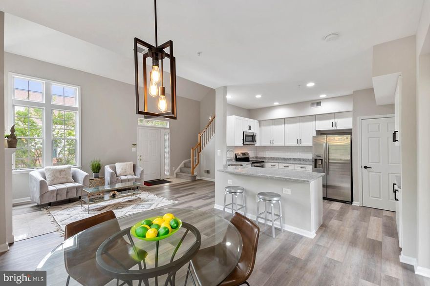 STUNNING LOCATION! RENOVATED INTERIOR! Welcome to this stunning, fully renovated two-level, 2 bed, 2 bath condo with a feel of a townhouse! Newly renovated throughout, new white shaker cabinets and counter top, new vanities, new floor, fresh paint and so much more. Your entrance to the unit offers high ceiling filled with natural light, the family room with vaulted ceiling and a fireplace with TV nook on the top , living and dining area, nicely sized kitchen with stainless steel appliances and granite counter tops; this sunny and spacious top unit has a lot to offer, featuring a master bedroom with dual vanities, separate shower and tub on the main level, the upper level offers a bedroom with an en-suite bathroom, 2 covered garage parking spaces, plenty of unsigned guest parking spaces, storage unit inside of the garage, trash and water are included . The condo is conveniently located across from West Falls Church Metro, walking distance to dinning and shopping, minutes to I-66 and I-495, Haycock/Longfellow/Mclean schools